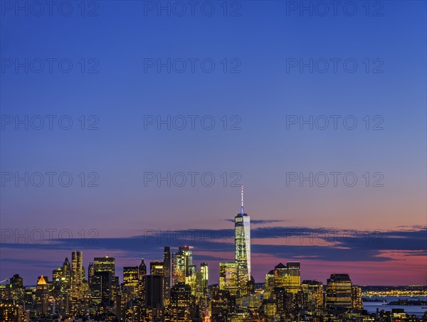 Skyline of New York at dusk with view of One World Trade Center. USA, New York, New York City.