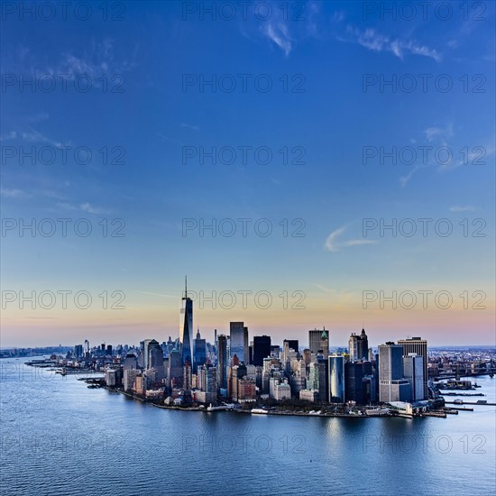 Urban skyline at dusk. USA, New York, New York City.