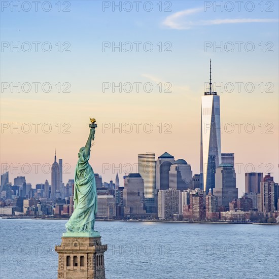 Statue of Liberty and One World Trade Centre. USA, New York, New York City.