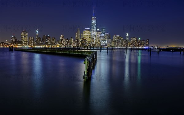 Illuminated cityscape at night. USA, New York, New York City.