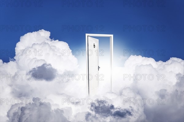 Opened door in clouds.