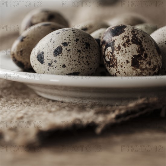 Quail eggs on plate.