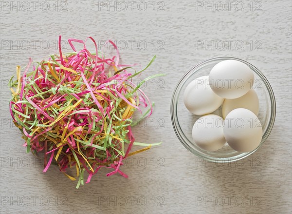 Eggs in bowl and colorful streamers
