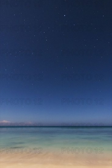 Stars on blue sky over sea