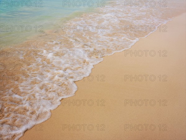 Surf on sandy beach