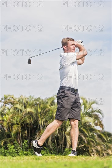 Man swinging golf club