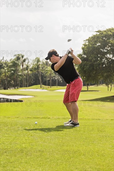 Man swinging golf club