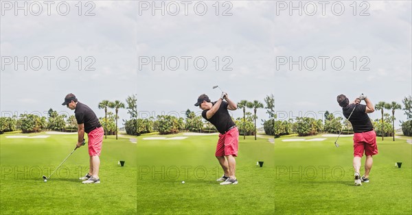 Man hitting ball with golf club