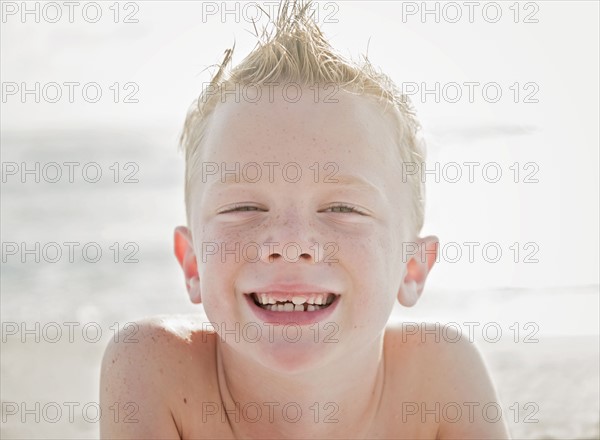 Portrait of boy (6-7) on beach