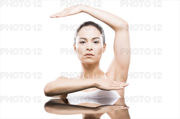 Young woman with raised arms