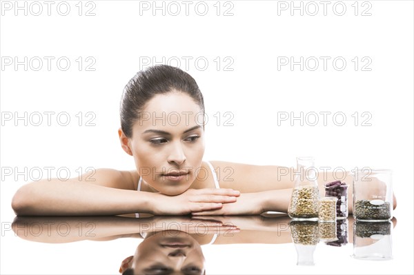 Young woman leaning on mirror