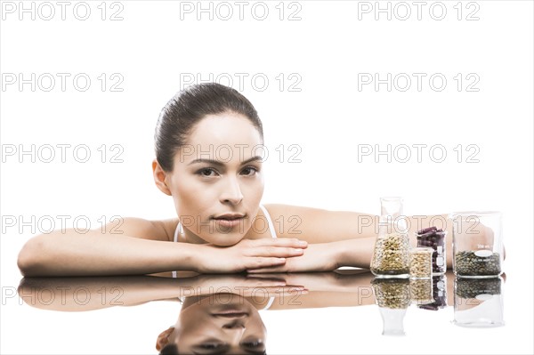 Young woman leaning on mirror