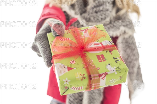 Young woman holding Christmas present