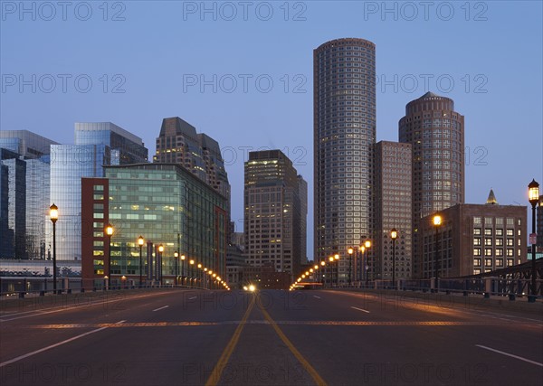 Empty city street with financial district in background