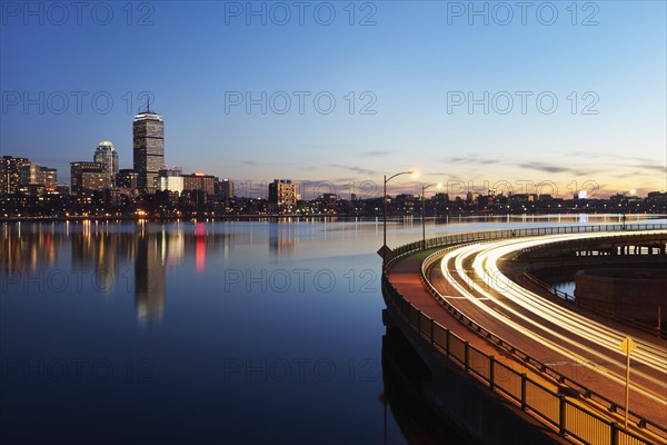 City skyline with traffic at dusk