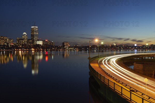 City skyline with traffic at dusk