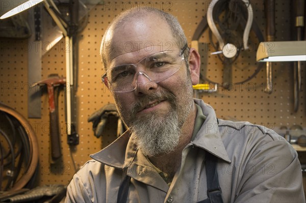 Portrait of jeweler in workshop