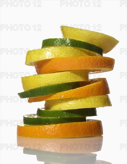 Stack of fruit on white background