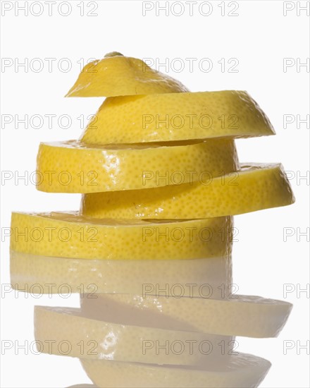 Slices of lemon on white background