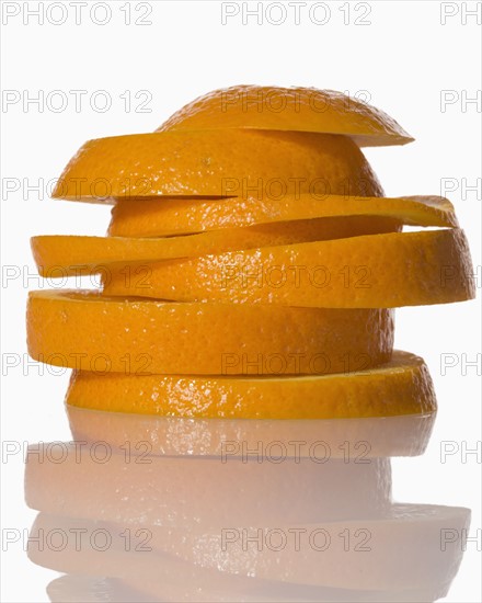 Slices of orange on white background