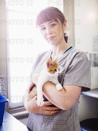 Portrait of vet with kitten