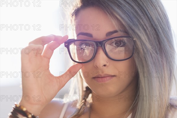Portrait of young woman in eyeglasses.