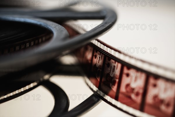 Close-up of film reel on white background.