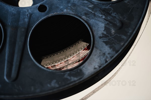 Close-up of film reel on white background.