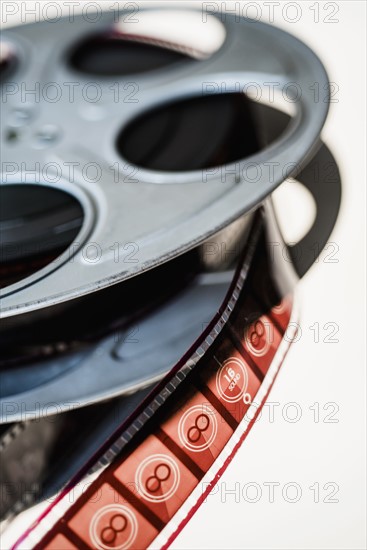Close-up of film reel on white background.