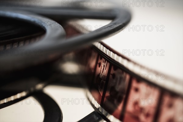 Close-up of film reel on white background.