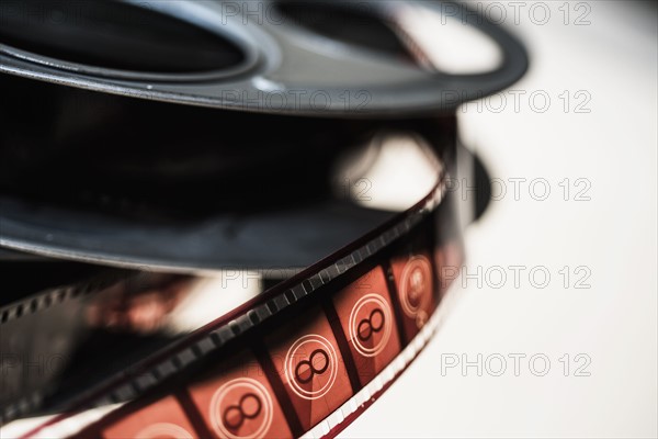 Close-up of film reel on white background.