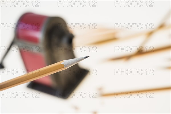 Pencil and antique pink pencil sharpener.