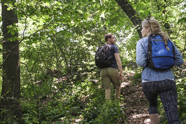 Couple hiking in forest.