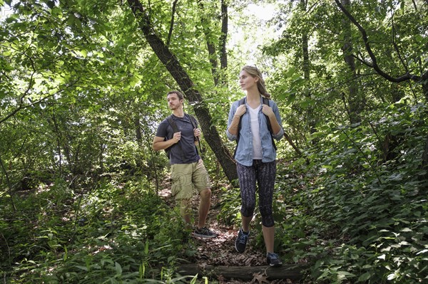 Couple hiking in forest.