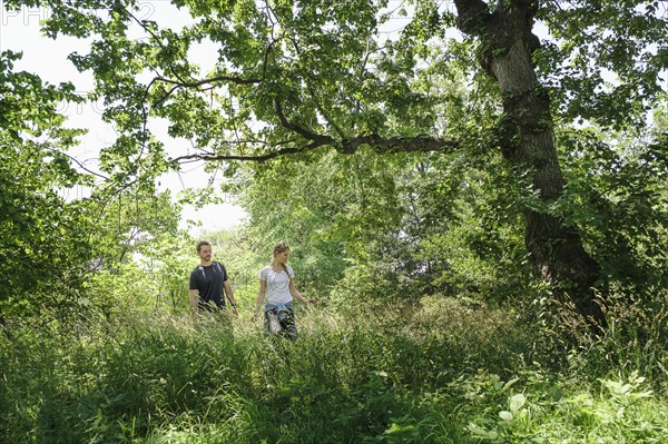 Couple hiking in forest.