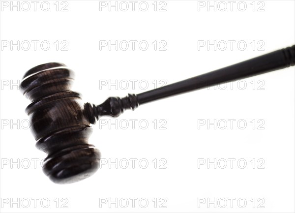 Wooden hammer against white background.