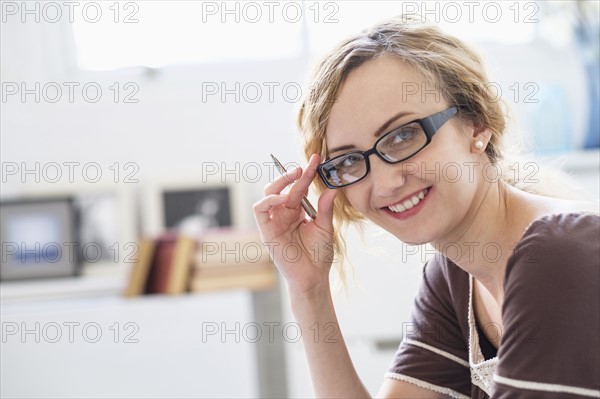 Portrait of woman in living room.