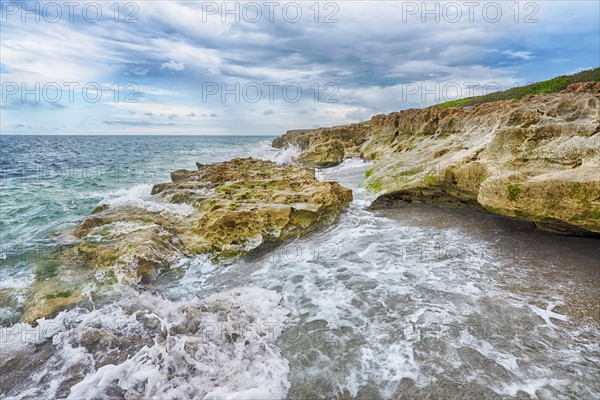 Cloudy sky over coastline