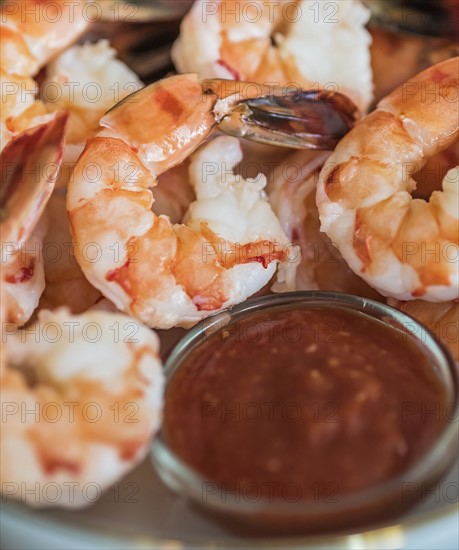 Shrimps and cocktail sauce in bowl