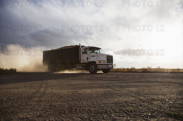 Truck driving in field