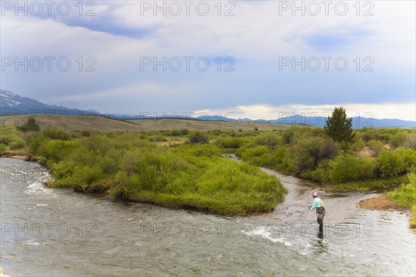 Colorado, Mid adult man fishing in river