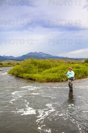 Colorado, Mid adult man fishing in river