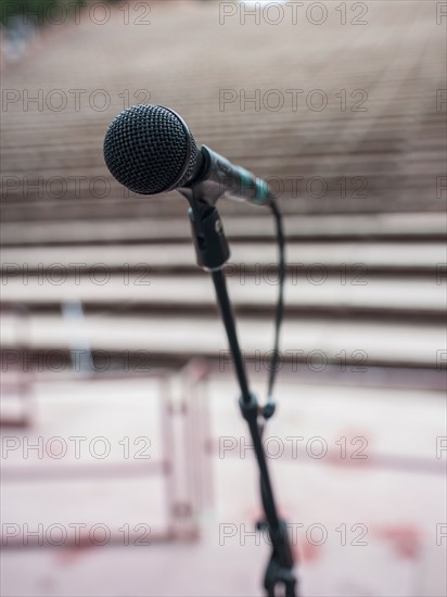 Microphone and empty amphitheater