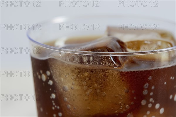 Close-up of cold drink with ice cubes