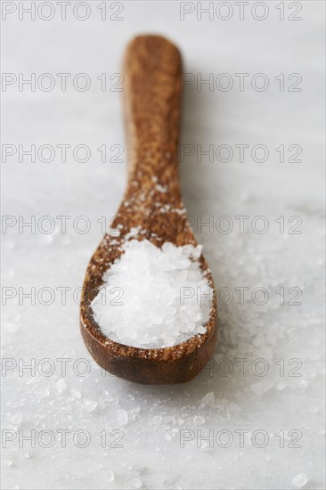 Wooden spoon with sea salt