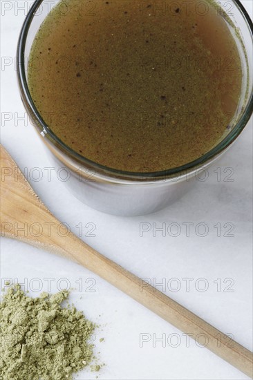 High angle view of glass of green juice