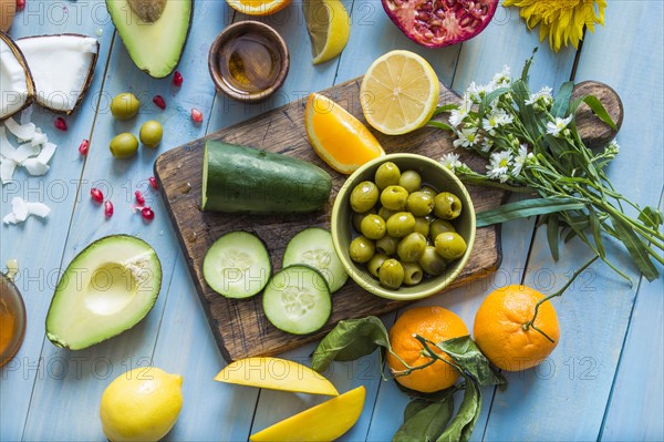 Overhead view of table with various vegetables and fruits