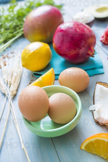 Eggs, oranges and pomegranates