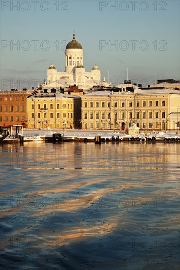 Finland, Helsinki, Harbor and cathedral at sunset