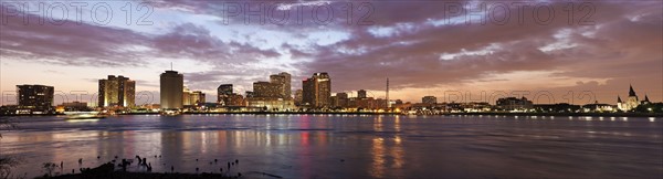 Louisiana, New Orleans, Mississippi river and city skyline with skyscrapers at sunset